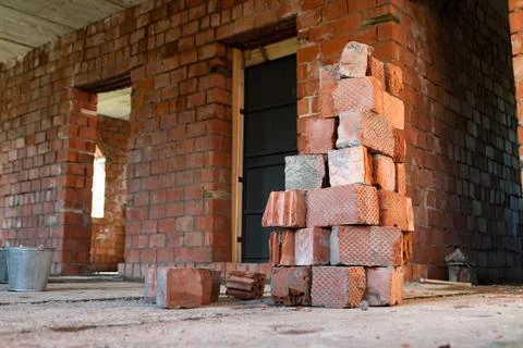 Pile of Bricks by an Old Brick Wall taken by an old building in St. Petersburg Stock Photos