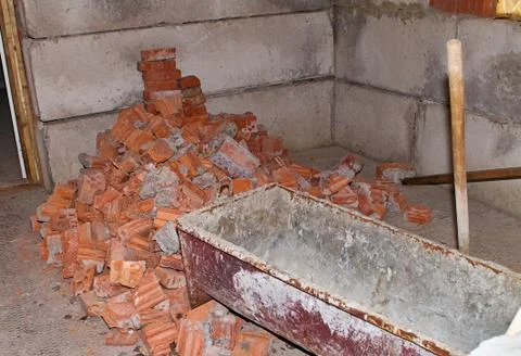 Pile of Bricks by an Old Brick Wall taken by an old building in St. Petersburg Stock Photos