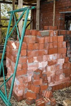 Pile of Bricks by an Old Brick Wall (taken by an old building in St. Petersburg Stock Photos