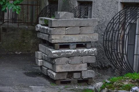 A pile of bricks is stacked on top of each other Stock Photos