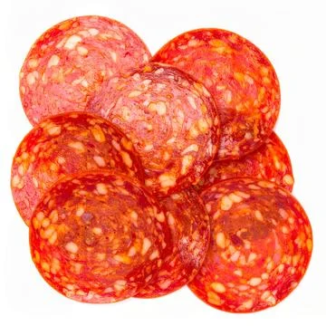 Pile of Bright Red Sliced Pepperoni, Cured and Spiced Pork and Beef Sausage.. Stock Photos