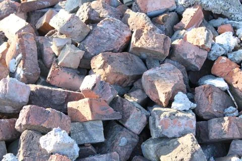 Pile of broken bricks and asphalt. construction waste Stock Photos