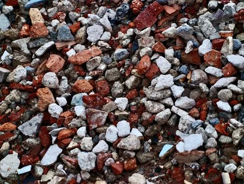 Pile of broken bricks and concrete rubble on ground Stock Photos