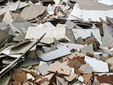 Pile of broken ceramic tiles with construction debris Stock Photos