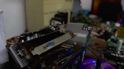 Pile of broken computer spare parts. VGA card, RAM, memory and other Video stock 280532084