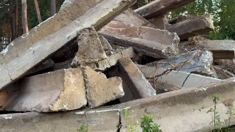 Pile of broken concrete slabs and rubble with rusty rebar outdoors Video stock 341830118