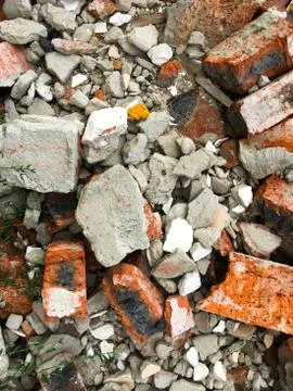 A pile of broken old red bricks. Background of bricks. Stock Photos