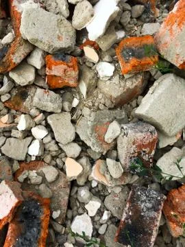 A pile of broken old red bricks. Background of bricks. Stock Photos