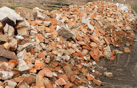 Pile of broken red bricks. Building bricks. Construction debris Stock Photos