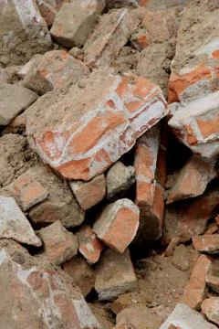 Pile of broken red bricks on construction site Stock Photos