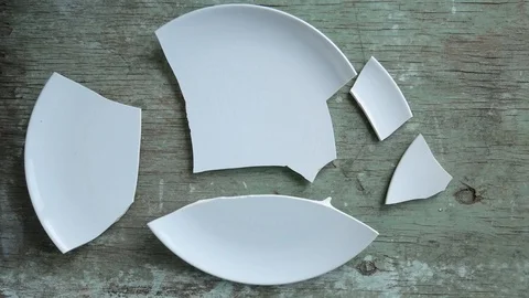Pile of broken white plates on rotating plate Video stock 92317784