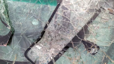 Pile of broken windshields - heap of cracked windscreens at a dump, due to Stock Footage 232955338