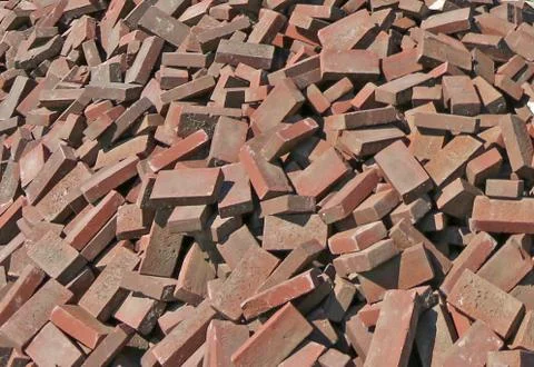 Pile of brown bricks Stock Photos