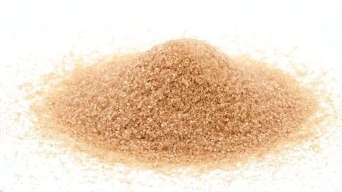 Pile of brown sugar and falling sugar on white background Stock Footage 144818490