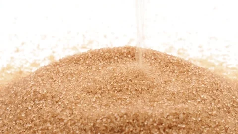 Pile of brown sugar and falling sugar on white background Stock Footage 146013053