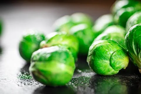 A pile of Brussels cabbage on the table. Stock Photos