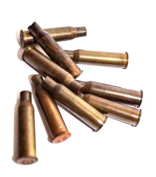 A pile bullet shells on a white background Illustrazione stock