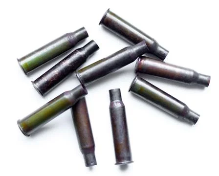 A pile bullet shells on a white background Illustrazione stock