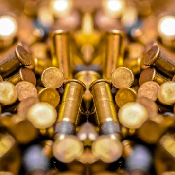 Pile of bullets in a mirrored reflection side Stock Photos