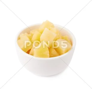 Pile of canned pineapple over isolated white background Stock Photos