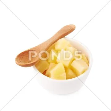 Pile of canned pineapple over isolated white background Stock Photos