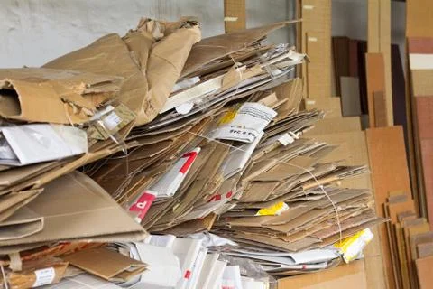 A pile of cardboard boxes and packaging, used paper for recycling on the back Stock Photos