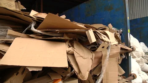 A pile of cardboard packaging ready for pressing Stock Footage 104646429