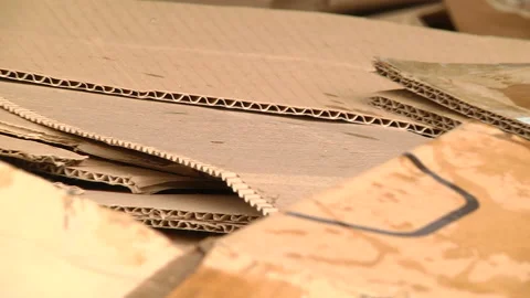 A pile of cardboard packaging ready for pressing Stock Footage 104646679