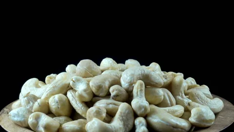 A pile of cashew nuts on a rotating close-up Stock Footage 137239762