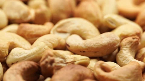 Pile cashew nuts without shell, rotates, close up. Stock Footage 238834994