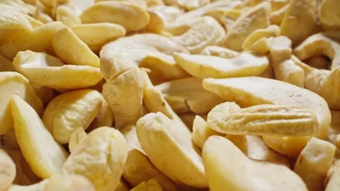Pile of cashews without shell. Texture of cashew kernel. Natural vegetarian food Stock Footage 291634656