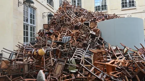 Pile of chairs stacked on display Stock Footage 286862355