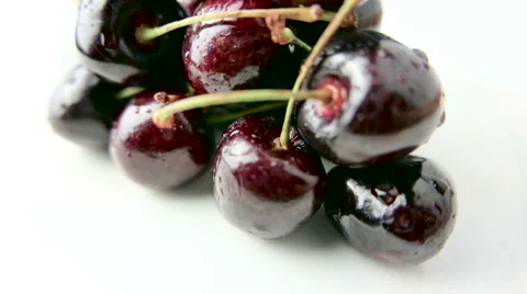 Pile of Cherries Rotating on White Background Stock Footage 62025495