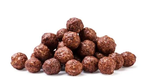 Pile of chocolate corn balls close-up on a white background. Isolated Stock Photos