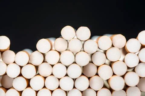 Pile of cigarettes background Stock Photos