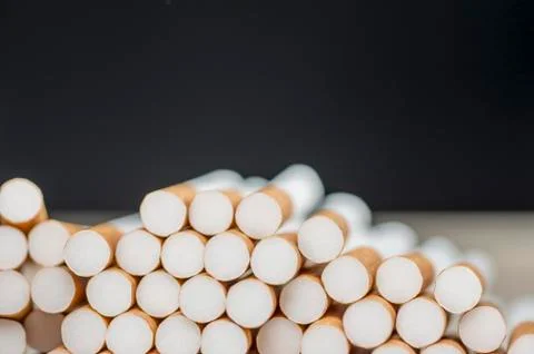 Pile of cigarettes background Stock Photos