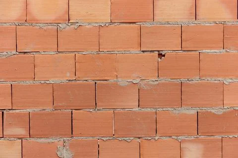 Pile of clay bricks used for building masonry house Stock Photos