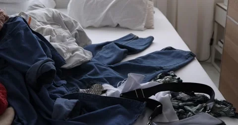 Pile of Clothes on Bed.  Stock Footage 277969399