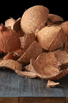 Pile of coconut fruit shell on table top Stock Photos