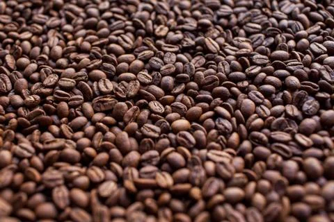 Pile of coffee beans. Background. Stock Photos