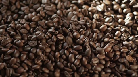 Pile of coffee beans with a lot of them being black Stock Footage 303945447