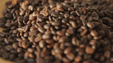 Pile of coffee beans on a table Stock Footage 301623246
