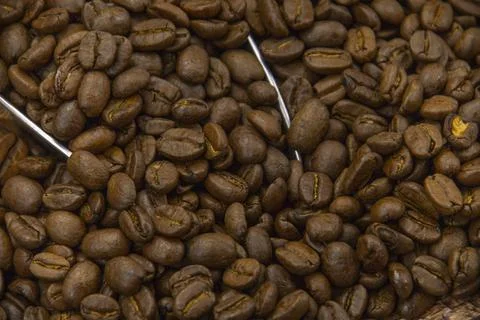 Pile of coffee beans on a table Stock Photos