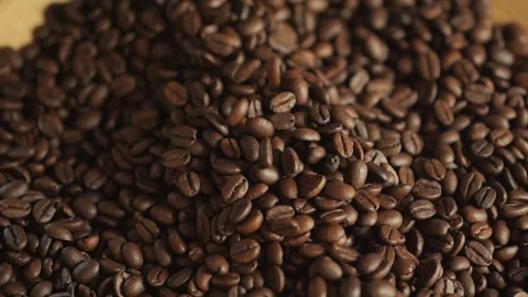Pile of coffee beans on a wooden surface Stock Footage 306588748