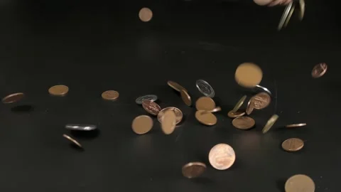 A pile of coins falls on the table, change is scattered on the table Stock Footage 264877049