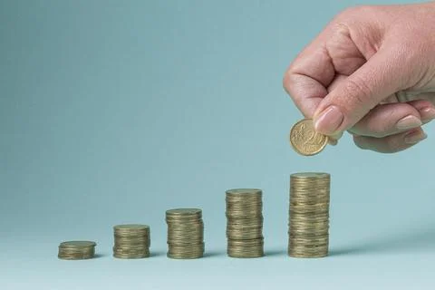 Pile coins forming graph Stock Photos