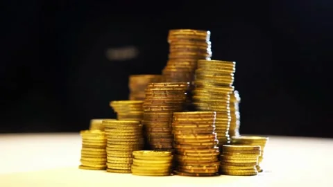 A pile of Coins on a white background stacks of gold money coin background Video stock 334027760
