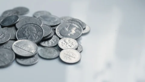 Pile of coins on white surface Stock Footage 124759695