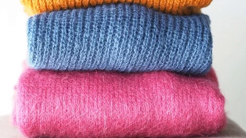Pile of color woolen sweaters Stock Footage 104913170