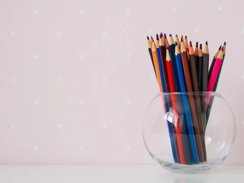 Pile of colored pencils close up in creative concept copy space Stock Photos